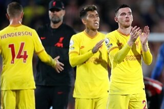 Football: Liverpool go top after thriller at Brentford