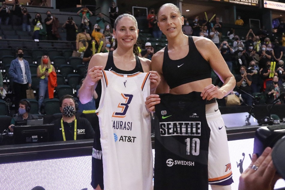 Sue Bird #10 of the Seattle Storm and Diana Taurasi #3 of the Phoenix Mercury swap jerseys after the game during the 2021 WNBA Playoffs on September 26, 2021 at the Angel of the Winds Arena, in Everett, Washington. Joshua Huston, NBAE via Getty Images/AFP
