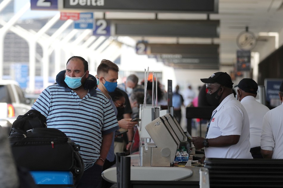 Passengers queue at LAX airport before Memorial Day weekend amid a pandemic in Los Angeles, on May 27, 2021. Lucy Nicholson, Reuters/file