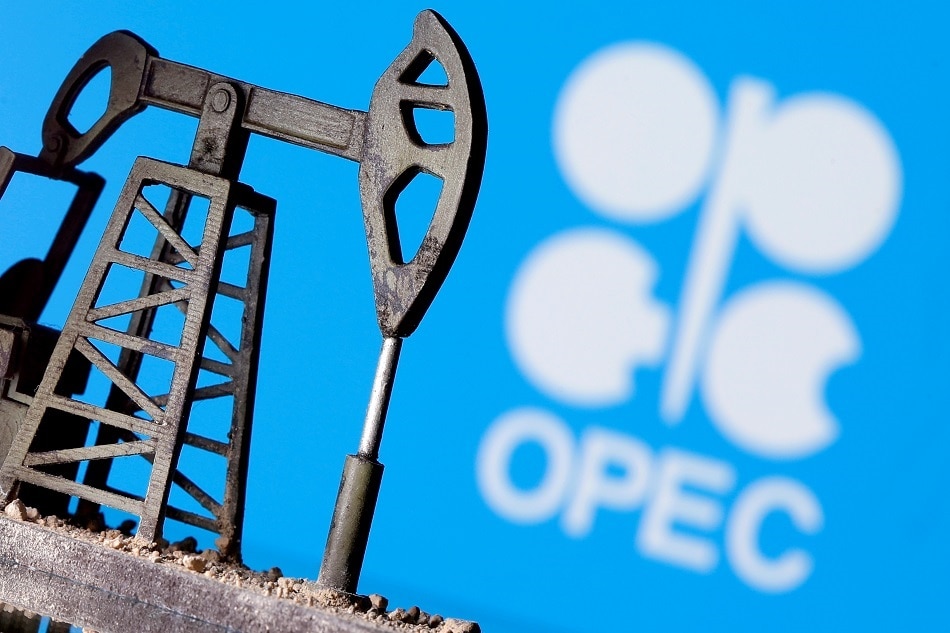 A 3D-printed oil pump jack is seen in front of a displayed OPEC logo in this illustration picture, April 14, 2020. REUTERS/Dado Ruvic/File Photo
