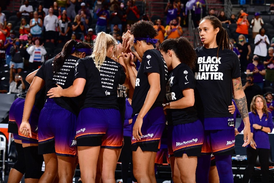 The Phoenix Mercury huddle up before the game against the Minnesota Lynx on July 3, 2021 at the Phoenix Suns Arena in Phoenix, Arizona. File photo. Barry Gossage, NBAE via Getty Images/AFP.