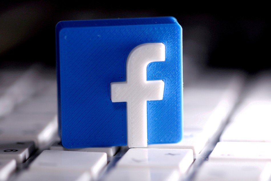 A 3D-printed Facebook logo is seen placed on a keyboard in this illustration taken March 25, 2020. Dado Ruvic, Reuters/Illustration//File Photo/File Photo