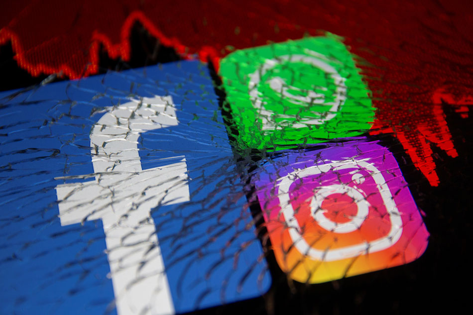 Facebook, Whatsapp and Instagram logos and stock graph are displayed through broken glass in this illustration taken October 4, 2021. Dado Ruvic, Reuters/Illustration