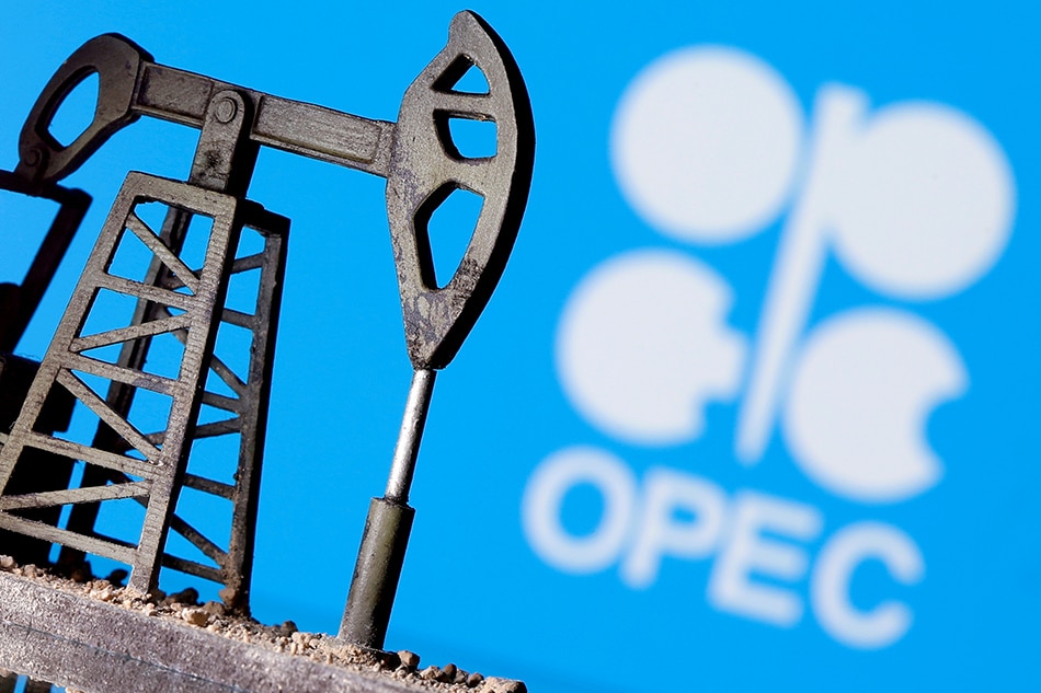A 3D-printed oil pump jack is seen in front of a displayed OPEC logo in this illustration picture, April 14, 2020. Dado Ruvic, Reuters/File Photo