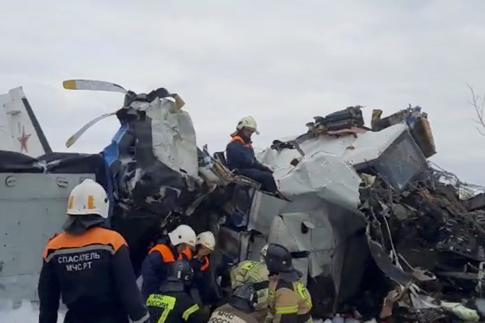 Emergency specialists work at the crash site of the L-410 plane near the town of Menzelinsk in the Republic of Tatarstan, Russia October 10, 2021, in this still image taken from video. Russia's Emergencies Ministry/Handout via Reuters