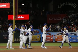 Dodgers overpower Giants to level MLB playoff series