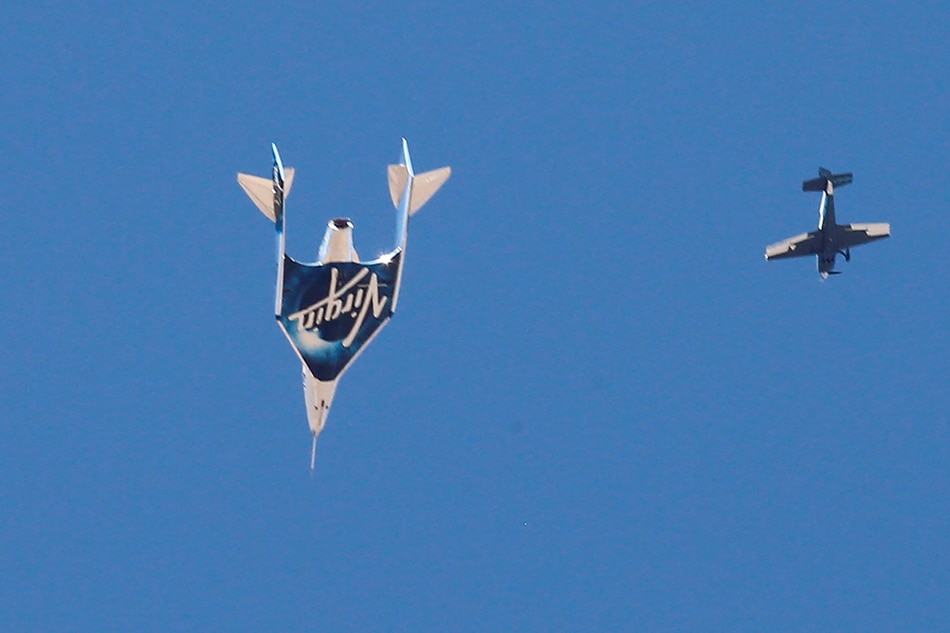 Virgin Galactic's passenger rocket plane VSS Unity, carrying billionaire entrepreneur Richard Branson and his crew, descends after reaching the edge of space above Spaceport America near Truth or Consequences, New Mexico, U.S., July 11, 2021. Joe Skipper, Reuters/File Photo