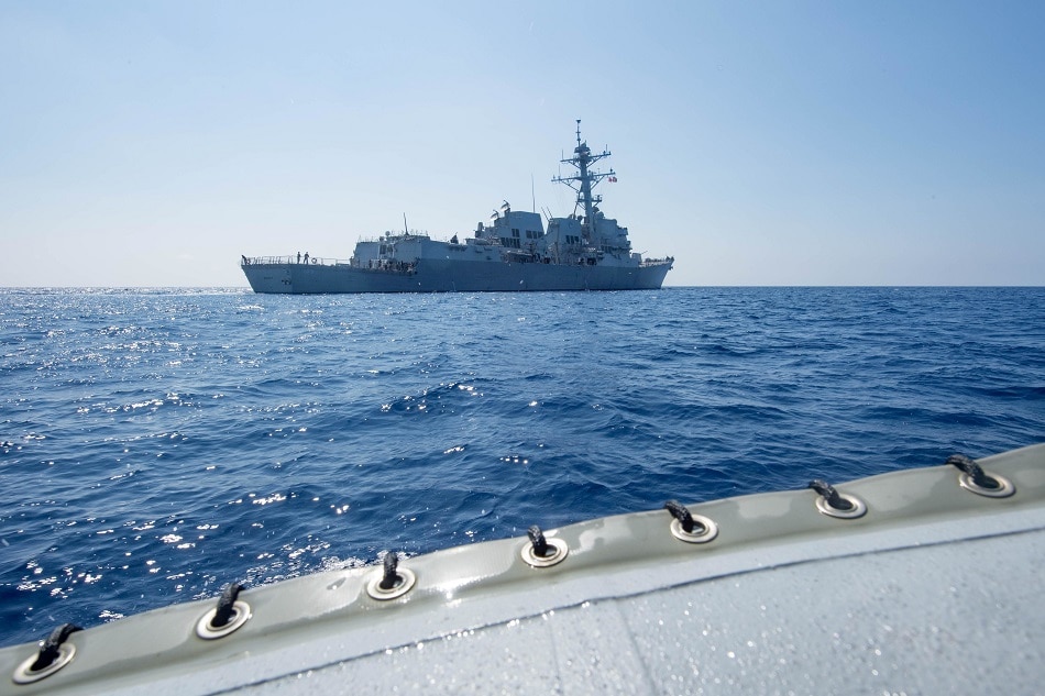 Arleigh Burke-class guided-missile destroyer USS Dewey transits the South China Sea May 6, 2017. Picture taken May 6, 2017. Kryzentia Weiermann/Courtesy U.S. Navy/Handout via Reuters