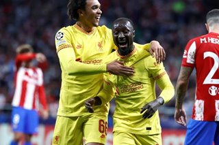Football: Liverpool battle to Champions League win 