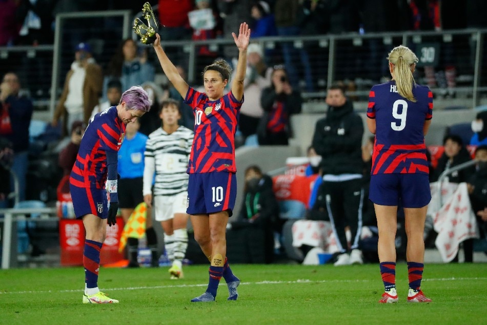 United States forward Carli Lloyd (10) removes her cleats and acknowledges the crowd as she leaves the game against South Korea in the second half an international friendly soccer match at Allianz Field. Bruce Kluckhohn, USA TODAY Sports/Reuters.