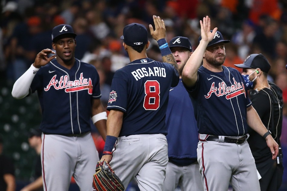 Atlanta Braves left fielder Eddie Rosario (8) celebrates with teammates after defeating the Houston Astros in game one of the 2021 World Series at Minute Maid Park. Troy Taormina, USA TODAY Sports/Reuters.