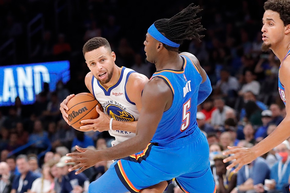 Golden State Warriors guard Stephen Curry (30) is defended by Oklahoma City Thunder forward Luguentz Dort (5) during the second quarter at Paycom Center. Alonzo Adams, USA TODAY Sports/Reuters.