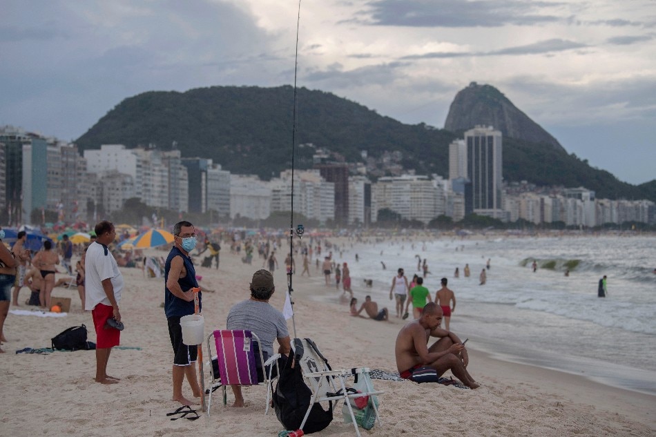 Beachgoers are seen at the Copacabana beach amid the COVID-19 coronavirus pandemic in Rio de Janeiro, Brazil, on December 29, 2020. Mauro Pimentel, Agence France-Presse