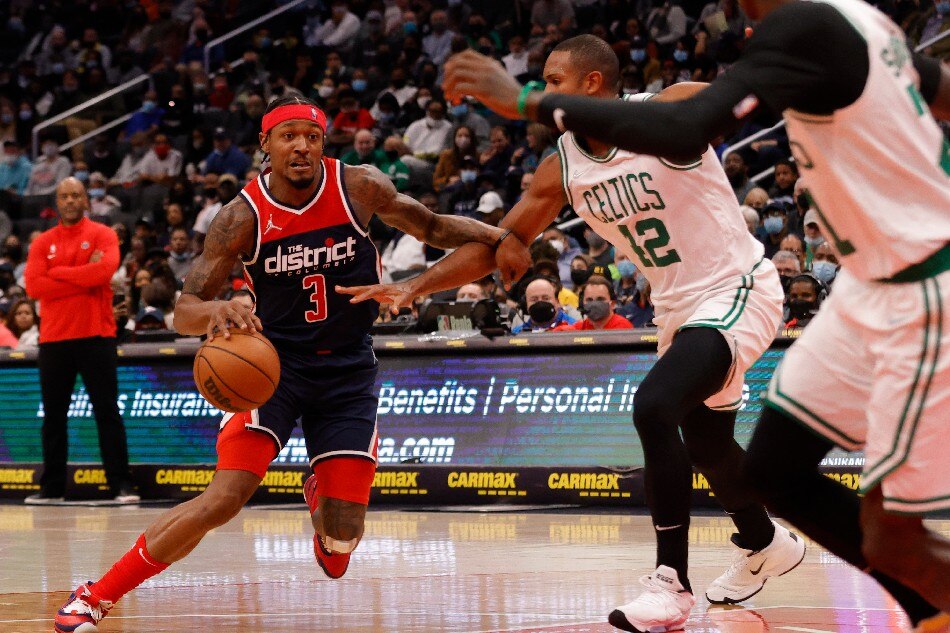 Washington Wizards guard Bradley Beal (3) drives to the basket as Boston Celtics center Al Horford (42) defends during the second quarter at Capital One Arena. Geoff Burke, USA TODAY Sports/Reuters
