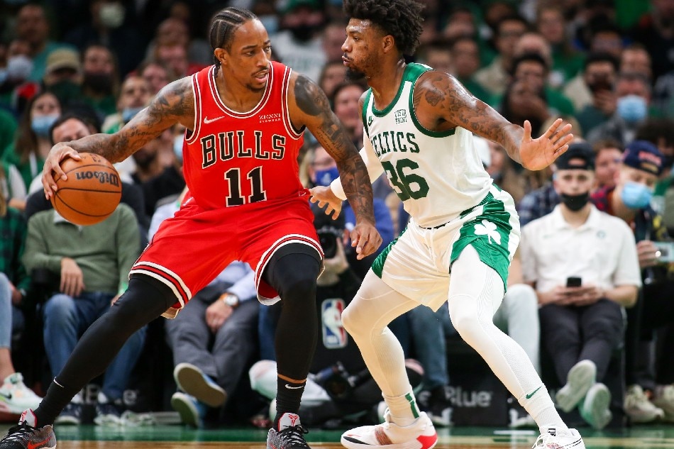 Chicago Bulls forward DeMar DeRozan (11) dribbles down the court defended by Boston Celtics guard Marcus Smart (36) during the first half at TD Garden. Paul Rutherford, USA TODAY Sports/Reuters