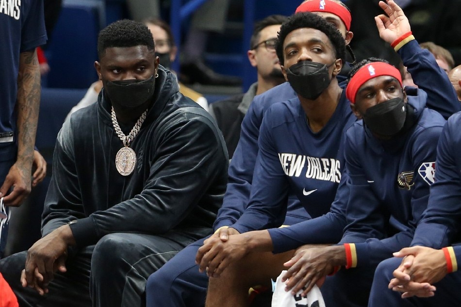 Injured Pelicans forward Zion Williamson (left) sits on the bench during their game against the Kings on October 29, 2021. Chuck Cook, USA Today Sports/Reuters