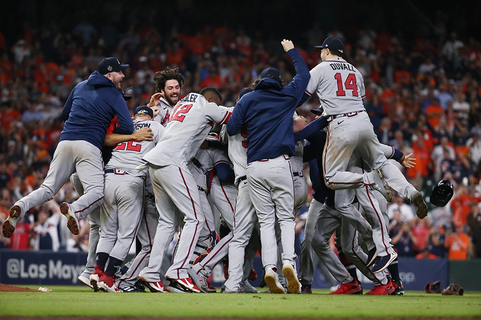 Atlanta Braves players celebrate after defeating the Houston Astros in game six of the 2021 World Series at Minute Maid Park. Troy Taormina, USA TODAY Sports/Reuters