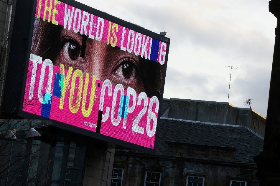An advertising board is seen during the UN Climate Change Conference (COP26), in Glasgow, Scotland, Britain, November 7, 2021. Yves Herman,Reuters/File Photo