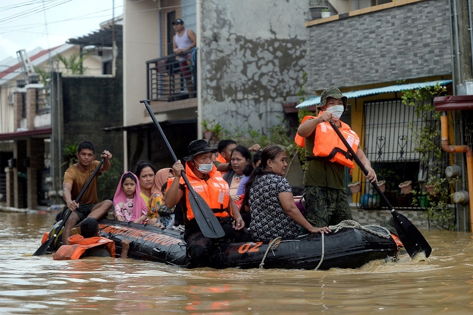 Residents on a rescue boat are evacuated from their flooded houses following Typhoon Vamco, in Rizal Province, Philippines, on November 12, 2020. Lisa Marie David, Reuters