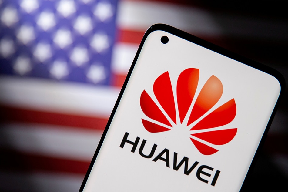 Smartphone with a Huawei logo is seen in front of a U.S. flag in this illustration taken September 28, 2021. Dado Ruvic, Reuters/Illustration//File Photo