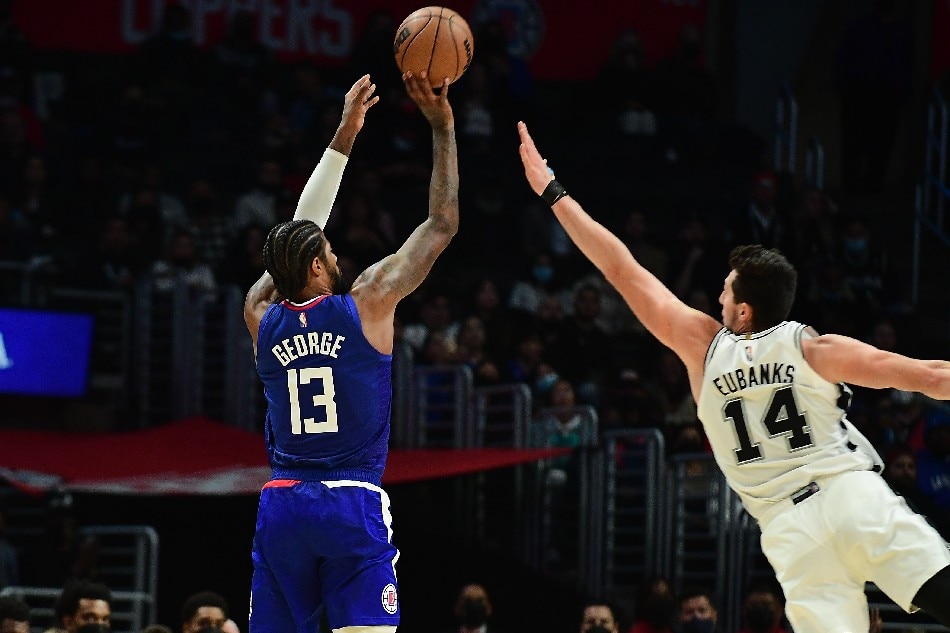 Los Angeles Clippers guard Paul George (13) shoots against San Antonio Spurs forward Drew Eubanks (14) during the second half at Staples Center. Gary A. Vasquez, USA TODAY Sports/Reuters
