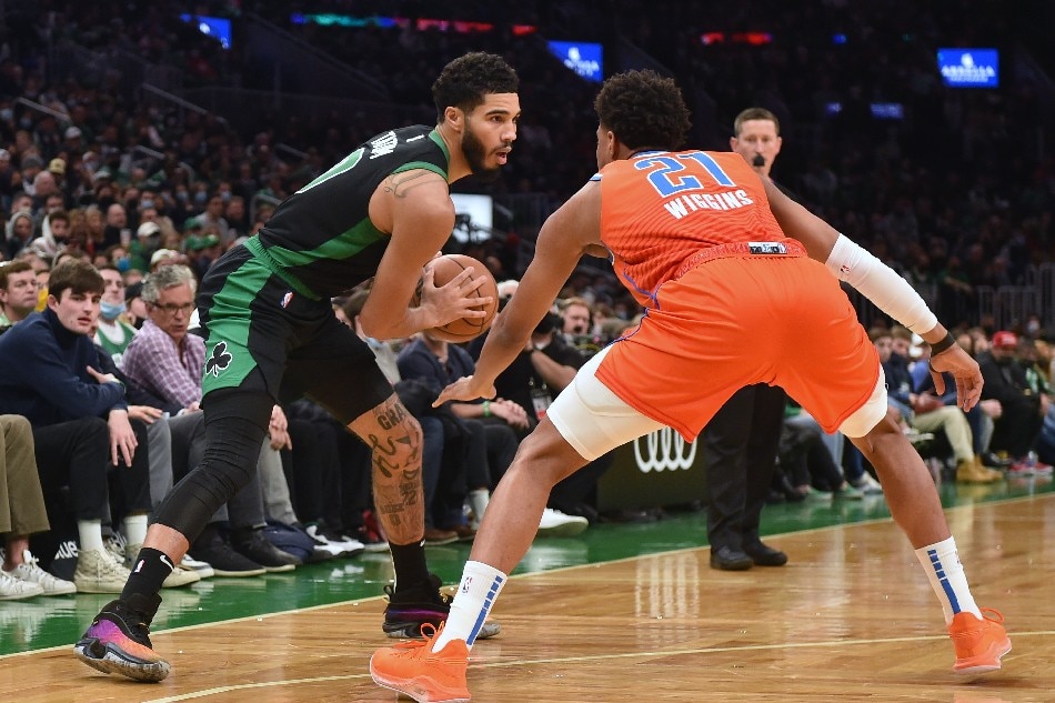 Boston Celtics forward Jayson Tatum (0) controls the ball while Oklahoma City Thunder guard Aaron Wiggins (21) defends during the second half at TD Garden. Bob DeChiara, USA TODAY Sports/Reuters
