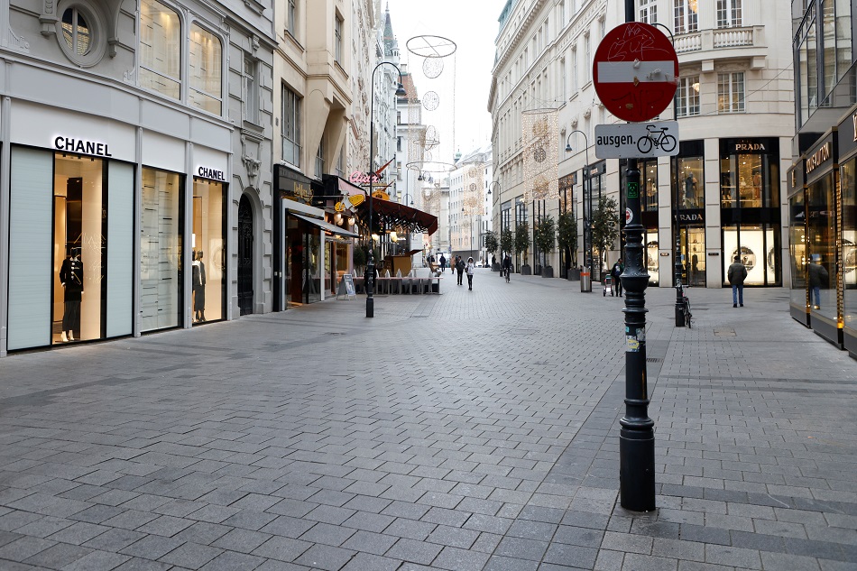 People walk in a shopping street as the Austrian government imposed fourth national COVID-19 lockdown in Vienna, November 22, 2021. Leonhard Foeger, Reuters