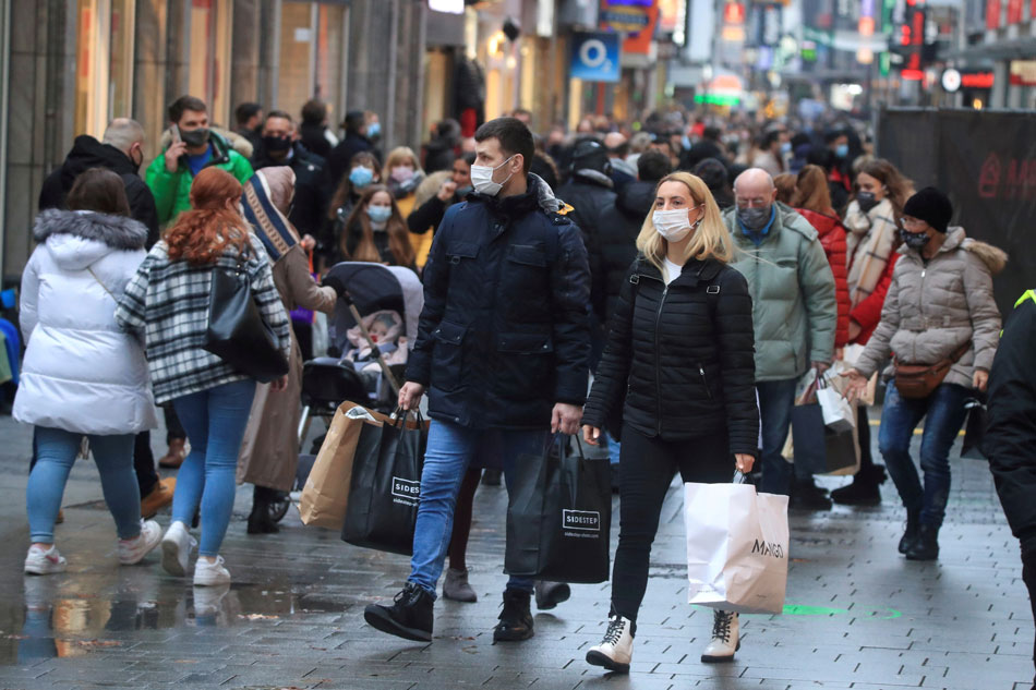Shoppers fill Cologne's main shopping street Hohe Strasse (High Street) in Germany on December 12, 2020. Wolfgang Rattay, Reuters/File Photo