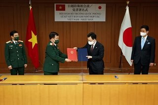 Japan, Vietnam oppose bids to change status quo in disputed seas