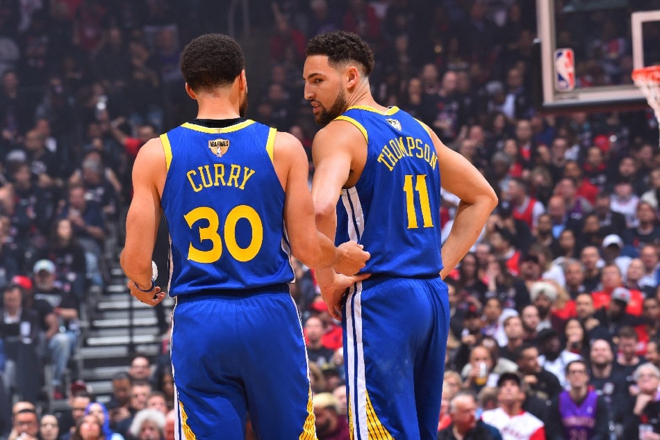 Curry and Thompson talk in Game 1 between Golden State and Toronto in the NBA Finals on May 30, 2019 at Scotiabank Arena in Toronto. Jesse D. Garrabrant, NBAE via Getty Images/AFP/file