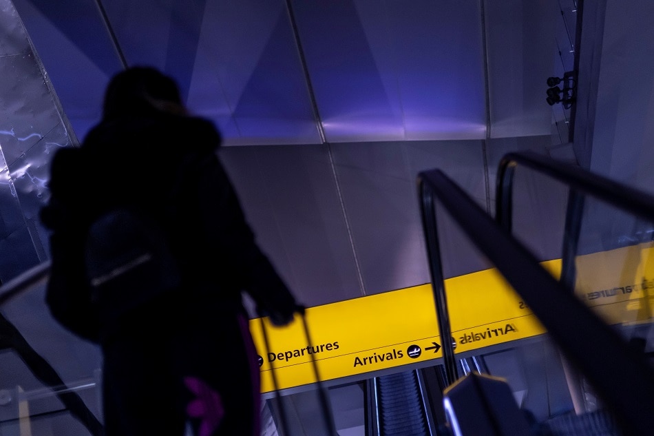 A passenger arrives at Terminal 2 of Heathrow International airport ahead of the lifting of restrictions on the entry of non-US citizens imposed to help curb the spread of the coronavirus disease in London on November 7, 2021. Carlos Barria, Reuters