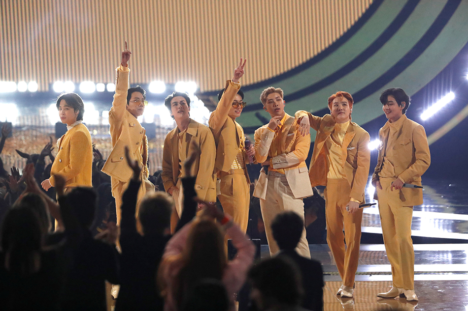 BTS performs during the 49th Annual American Music Awards at Microsoft Theatre in Los Angeles on November 21, 2021. Mario Anzuoni, Reuters