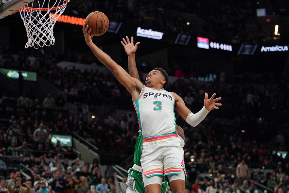  San Antonio Spurs forward Keldon Johnson (3) shoots in the second half against the Boston Celtics at the AT&T Center. Daniel Dunn, USA TODAY Sports via Reuters