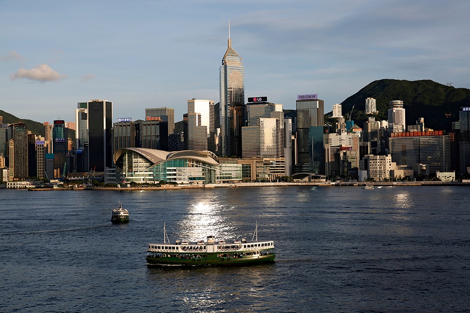 A Star Ferry boat crosses Victoria Harbour in front of a skyline of buildings in Hong Kong, China, June 29, 2020. Tyrone Siu, Reuters/File