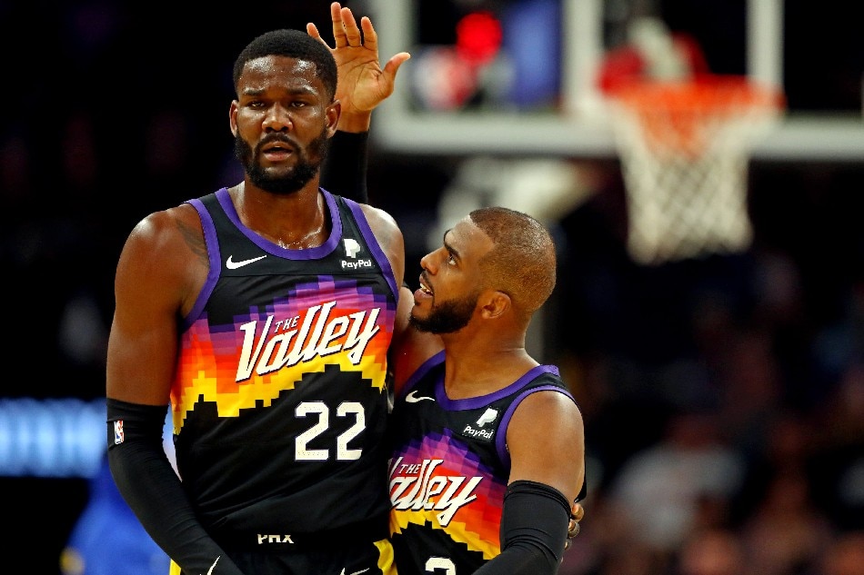 Phoenix Suns guard Chris Paul (3) reacts with center Deandre Ayton (22) during the third quarter against the Golden State Warriors at Footprint Center. Mark J. Rebilas, USA TODAY Sports/Reuters.