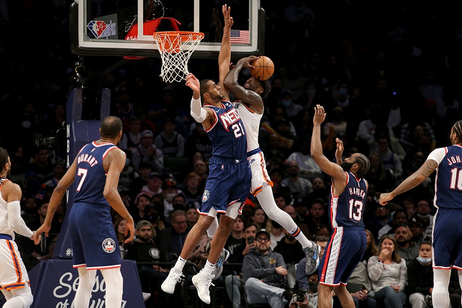 New York Knicks forward Julius Randle (30) is fouled as he drives to the basket by Brooklyn Nets forward LaMarcus Aldridge (21) during the fourth quarter at Barclays Center. Brad Penner, USA TODAY Sports/Reuters