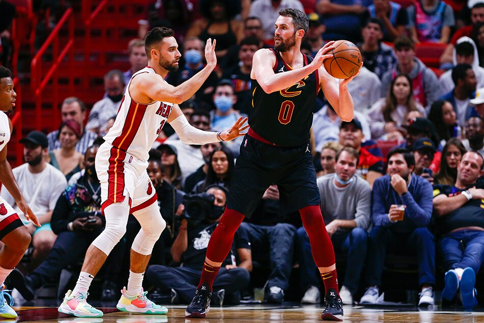 Cleveland Cavaliers forward Kevin Love (0) protects the ball against Miami Heat guard Max Strus (31) during the third quarter at FTX Arena. Sam Navarro, USA TODAY Sports/Reuters