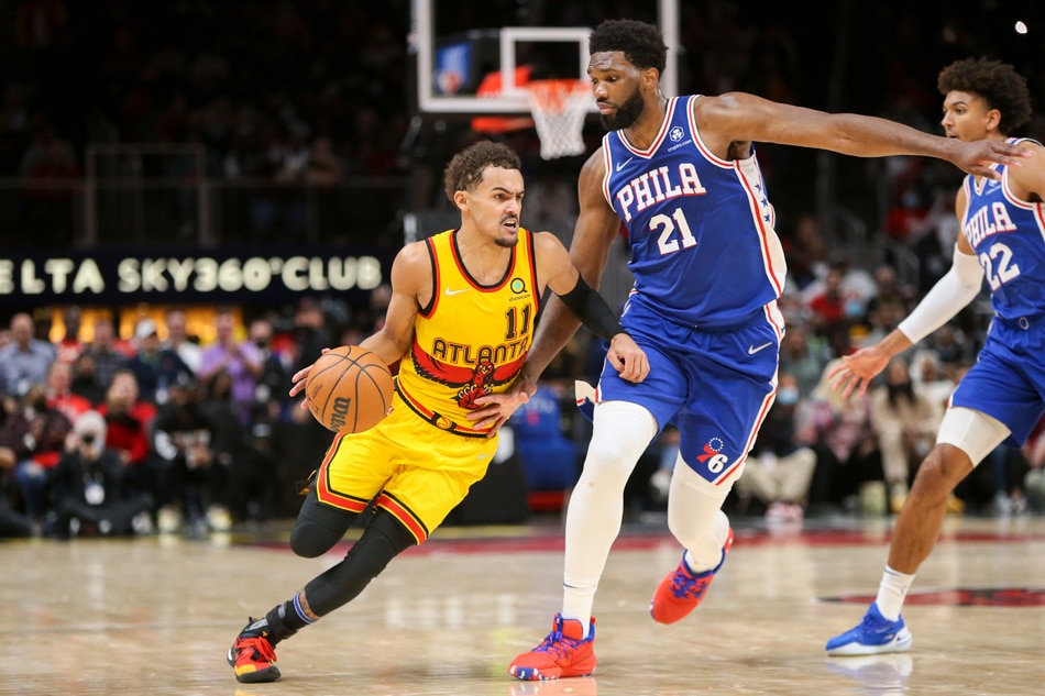 : Atlanta Hawks guard Trae Young (11) is defended by Philadelphia 76ers center Joel Embiid (21) in the second half at State Farm Arena. Brett Davis, USA TODAY Sports via Reuters