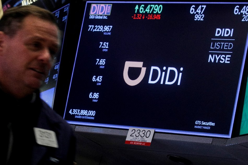 A screen displays trading information for ride-hailing giant Didi Global on the floor of the New York Stock Exchange (NYSE) in New York City, US, December 3, 2021. Brendan McDermid, Reuters/File