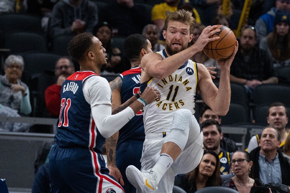 Indiana Pacers forward Domantas Sabonis (11) rebounds the ball over Washington Wizards center Daniel Gafford (21) in the first quarter at Gainbridge Fieldhouse. Trevor Ruszkowski, USA TODAY Sports/Reuters.