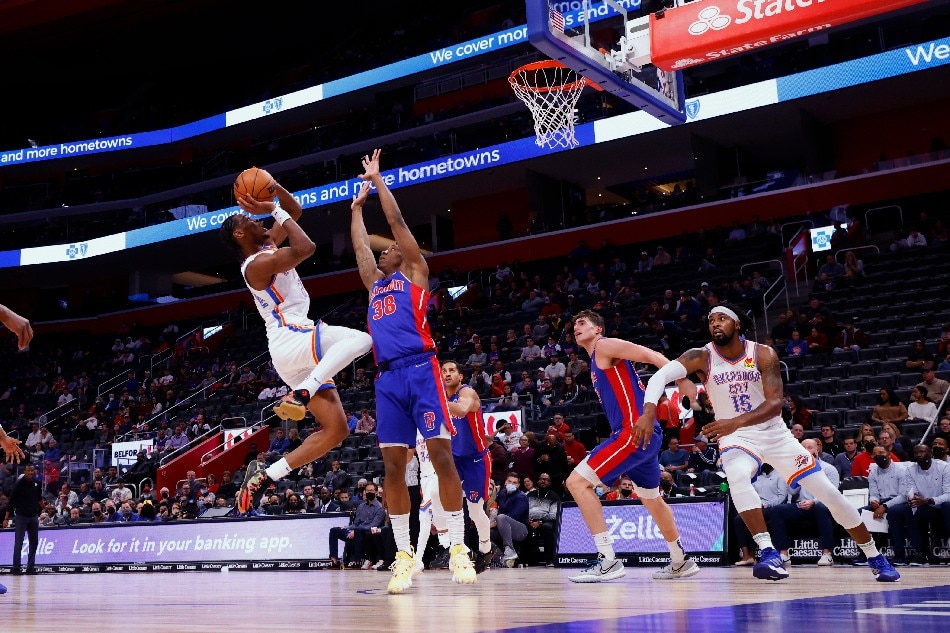 Oklahoma City Thunder guard Shai Gilgeous-Alexander (2) shoots on Detroit Pistons guard Saben Lee (38) in the first half at Little Caesars Arena. Rick Osentoski, USA TODAY Sports/Reuters.