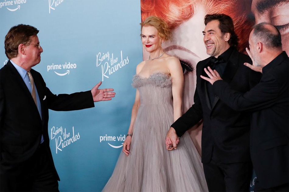 Director Aaron Sorkin approaches cast members Nicole Kidman and Javier Bardem as they attend the premiere for the film Being the Ricardos at the Academy Museum of Motion Pictures in Los Angeles, California, U.S. December 6, 2021. REUTERS/Mario Anzuoni