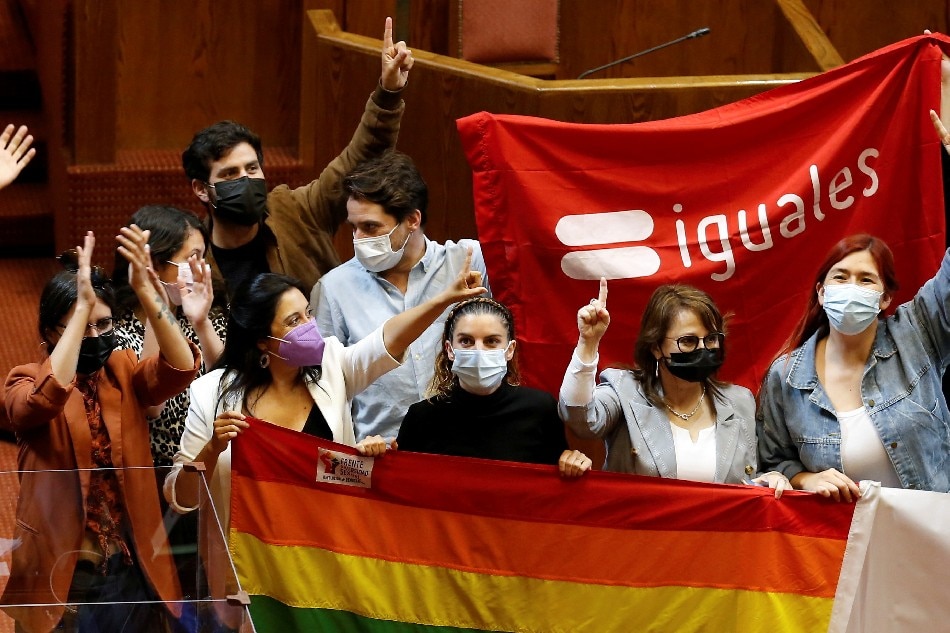 People react at the Chamber of Deputies as the Senate votes to approve a same-sex marriage bill in Valparaiso, Chile December 7, 2021. REUTERS/Rodrigo Garrido