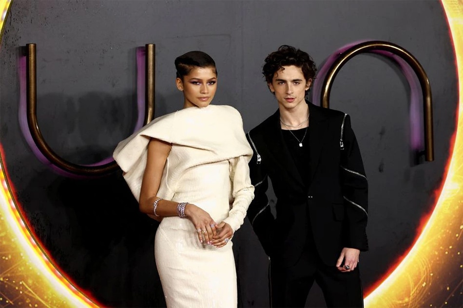 Cast members Zendaya and Timothee Chalamet pose as they arrive for a UK screening of the film 