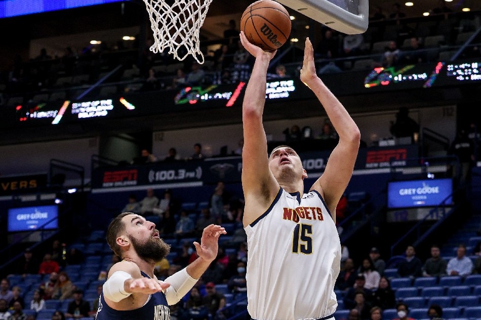 Denver Nuggets center Nikola Jokic (15) moves to the basket against New Orleans Pelicans center Jonas Valanciunas (17) during the first half at Smoothie King Center. Stephen Lew, USA TODAY Sports/Reuters.
