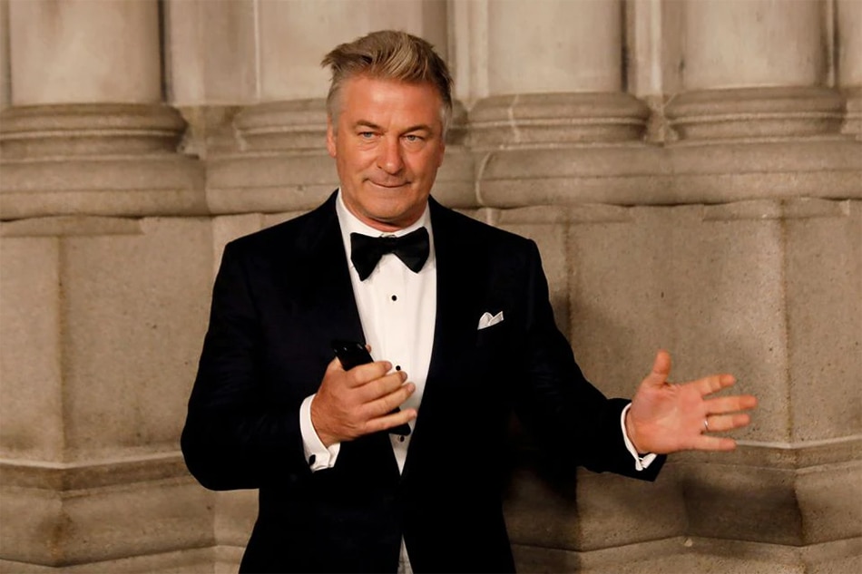 Actor Alec Baldwin gestures before walking on the red carpet at the Cathedral of St. John the Divine in New York City, in New York, November 7, 2017. REUTERS/Shannon Stapleton/File Photo