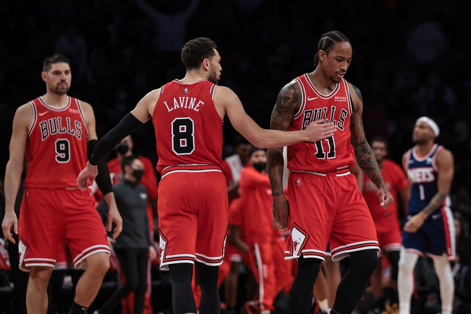 :::CAPTION--- Bulls guard Zach LaVine and teammate forward DeMar DeRozan in a game against the Nets on December 4, 2021. Vincent Carchietta, USA Today Sports/Reuters