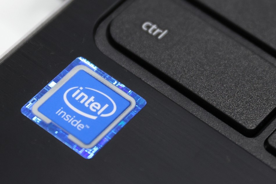 An Intel Corporation logo is seen on a sticker on a laptop for sale in Queens, New York, U.S., November 16, 2021. Andrew Kelly, Reuters/File