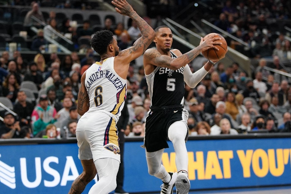 San Antonio Spurs guard Dejounte Murray (5) drives to the basket against New Orleans Pelicans guard Nickeil Alexander-Walker (6) in the second half at the AT&T Center. Daniel Dunn, USA TODAY Sports/Reuters