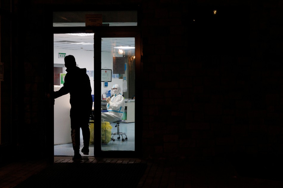 A man enters a COVID-19 testing station at the Thaiwoo ski resort in Zhangjiakou, Hebei province, China, November 20, 2021. Picture taken November 20, 2021. Thomas Peter, Reuters
